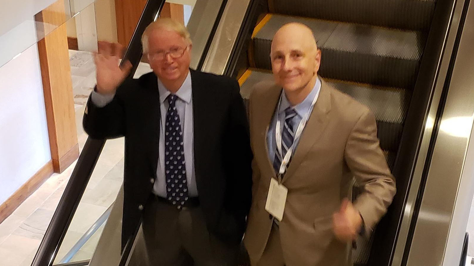 Boyd Haley and Randall Moore together at a conference (escalator photo).